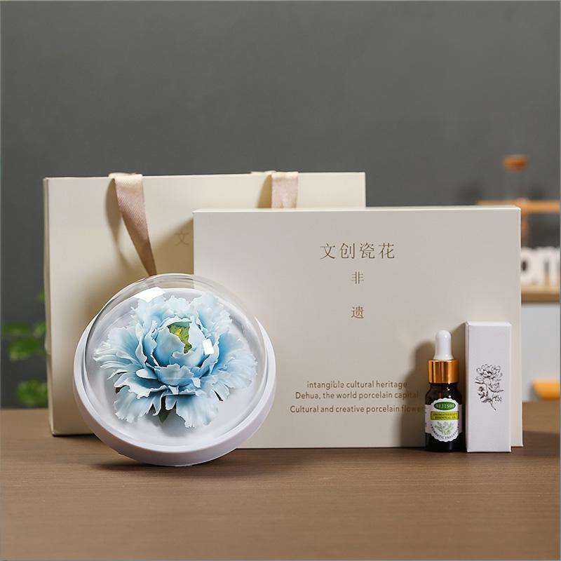 The handmade flower ceramic diffuser in blue color.