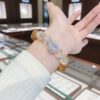 A woman wearing the Leo Zodiac crystal energy bracelet, showing how it looks on the wrist.