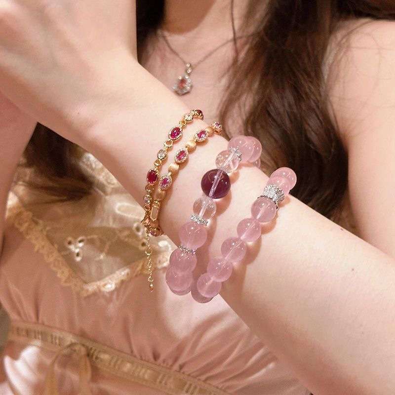 A woman wearing the Libra Zodiac crystal energy bracelet, showing how it looks on the wrist.