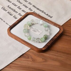 A close-up detail shot of the Green Fluorite quartz crystal bead on the Taurus Zodiac.