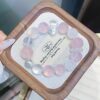 A close-up detail shot of the Rose quartz crystal bead on the Virgo Zodiac.