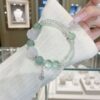 A woman wearing the Chinese Goat Zodiac crystal energy bracelet, showing how it looks on the wrist.