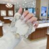 A woman wearing the Chinese Rabbit Zodiac crystal energy bracelet, showing how it looks on the wrist.