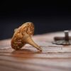 A close-up of the precision-engineered, durable tip of the brass fidget spinner, designed for a long and stable spin.