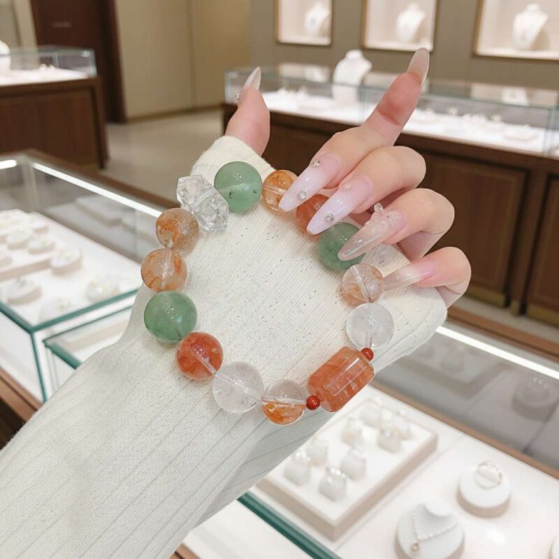 A woman wearing the Chinese Ox Zodiac crystal energy bracelet, showing how it looks on the wrist.
