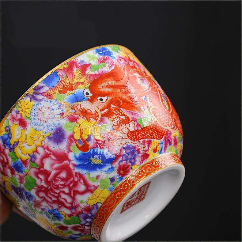 The imperial detailed Interlocking Lotus enameled handmade ceramic teacup, showcasing intricate pink and white lotus flowers.