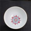 The imperial detailed Interlocking Lotus enameled handmade ceramic teacup, showcasing intricate pink and white lotus flowers.