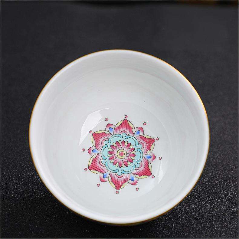 The imperial detailed Interlocking Lotus enameled handmade ceramic teacup, showcasing intricate pink and white lotus flowers.