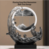 A Feng Shui Moving Sand Art Sandscape in black color with description.