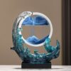A Feng Shui Moving Sand Art Sandscape in blue color on the desk.