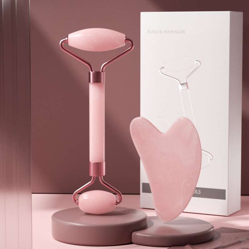 A self-care gift set featuring a pink rose quartz gua sha and a matching facial roller, perfect for a beauty and wellness present.