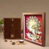Elegant walnut framed 3D Chinese Paper Cutting artwork placed on a shelf, adding a touch of oriental Zen and Feng Shui fortune to the room.