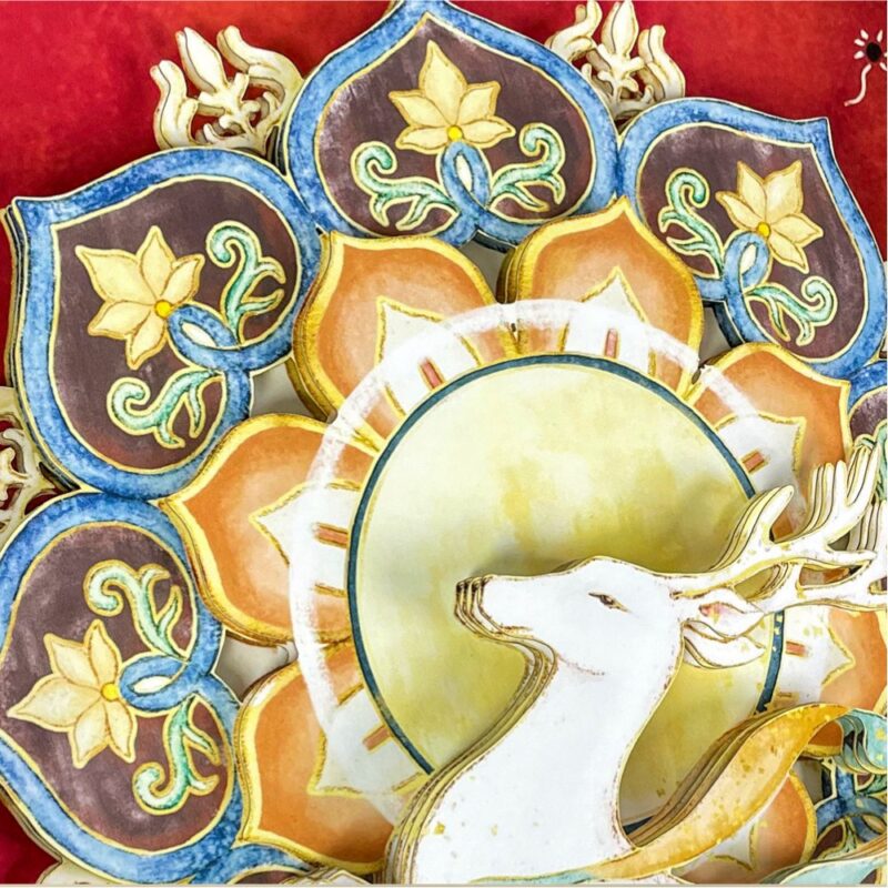 Close up of the Nine-Colored Deer 3D Chinese Paper Cutting showing the multi-layered paper craftsmanship and vibrant Dunhuang fresco colors.