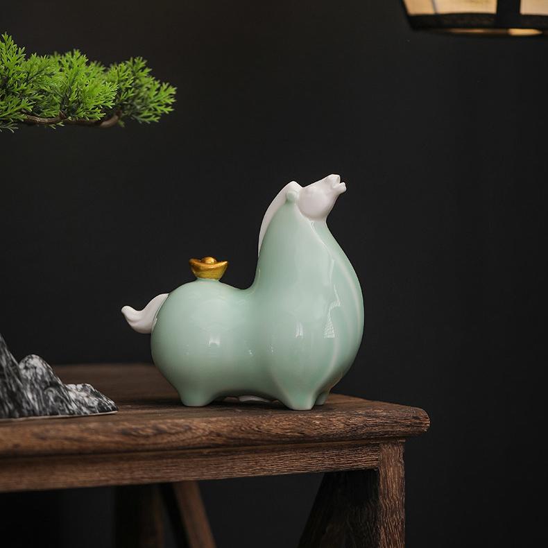 Close up detail of the golden cauliflower on the back of a cyan Chinese Ceramic Tang Horse Statue, symbolizing the pun for getting rich immediately.