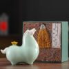A gold ingot of Chinese Ceramic Tang Horse Statue.