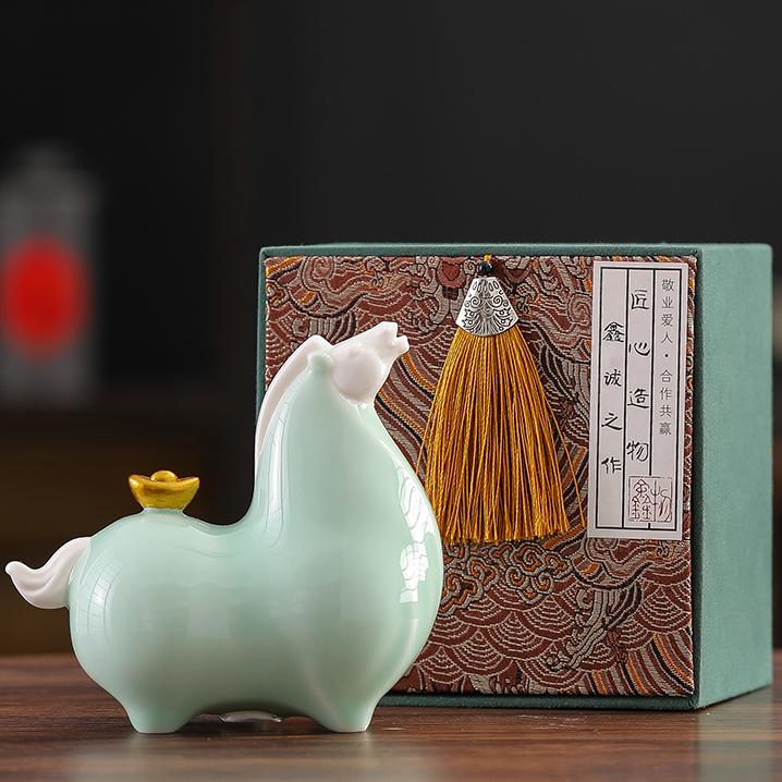 A gold ingot of Chinese Ceramic Tang Horse Statue.