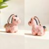 Collection of Handmade Brocade Guardian Horse Embroidery Amulet charms in pink, black, and other colors, hanging together to show the variety of Lunar New Year gifts.