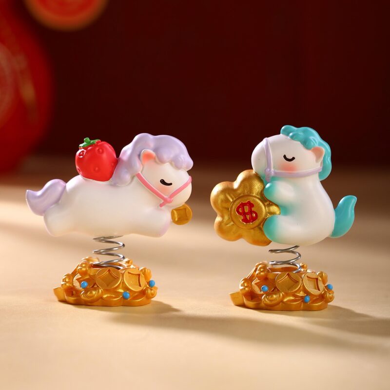 Cute Year of the Horse Creative Spring Ornament figures displayed together, showing the resin craftsmanship and different symbols like persimmons and strawberries.