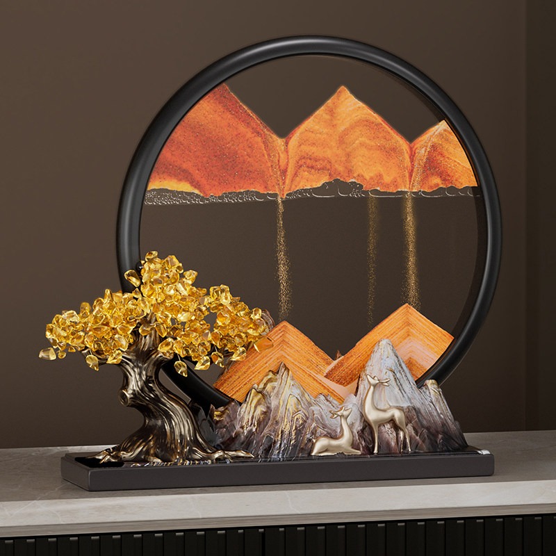 Elegant Feng Shui Moving Sand Art placed on a modern console table, showcasing the golden sand forming a mountain backing for the fortune deer statues.