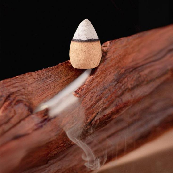 Step-by-step guide on how to light Natural Waterfall Backflow Cones and place them on the burner hole for the best smoke effect.
