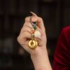 Lotus Flower Feng Shui Keychain on hand