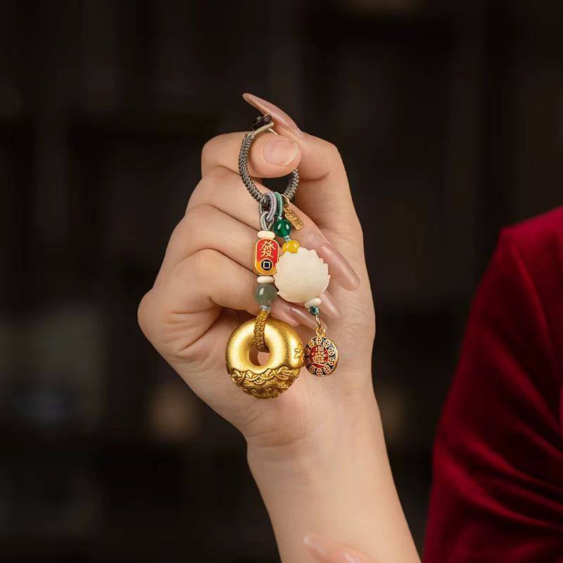 Lotus Flower Feng Shui Keychain on hand